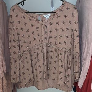 Quarter length sleeved pink shirt with roses